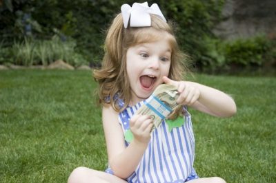 Little Girl Holding Money 53237632729 400x266 1