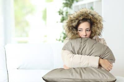 Bigstock Woman Warmly Clothed In A Cold 112935647 400x267 1