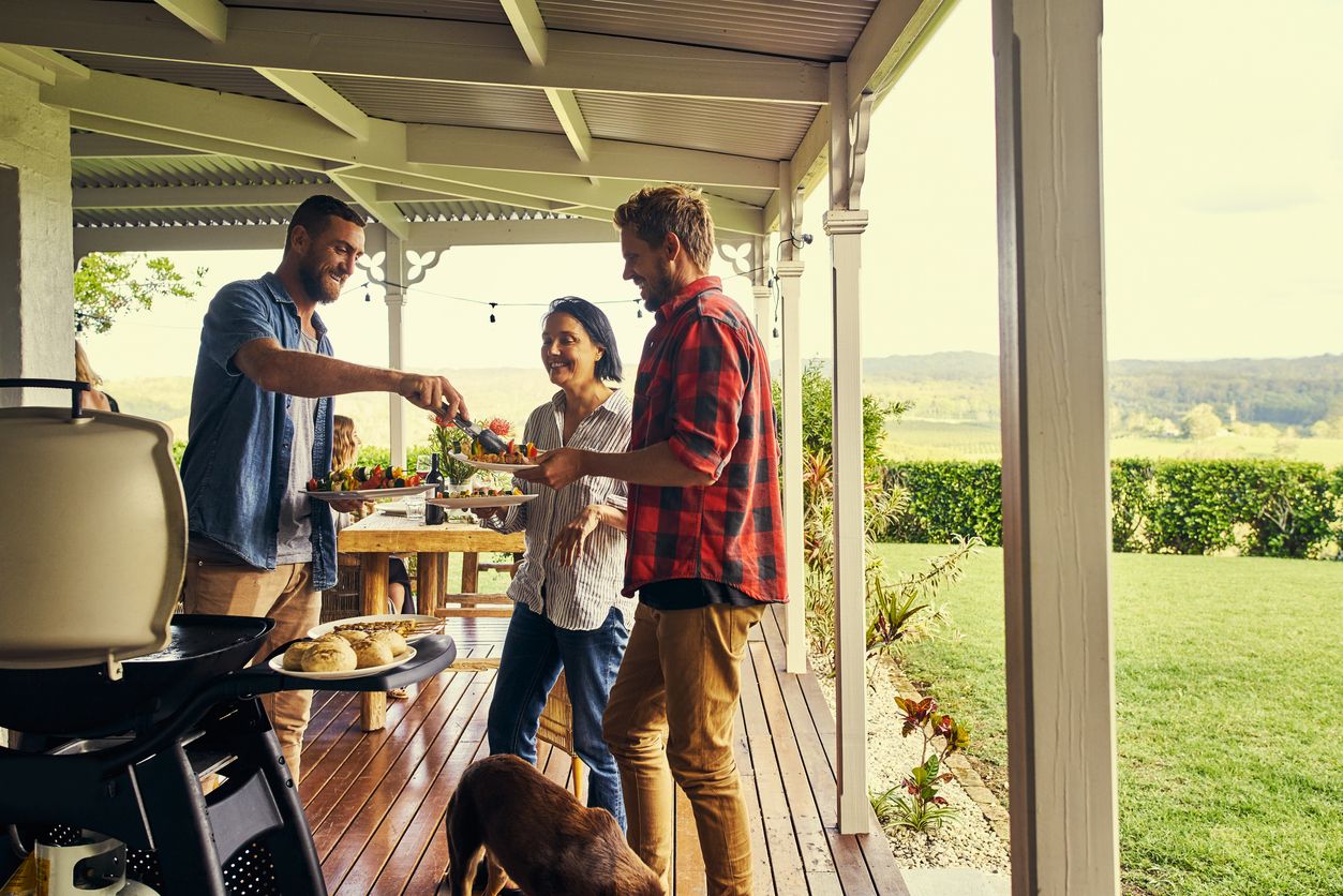 Friends Having Bbq During Summer