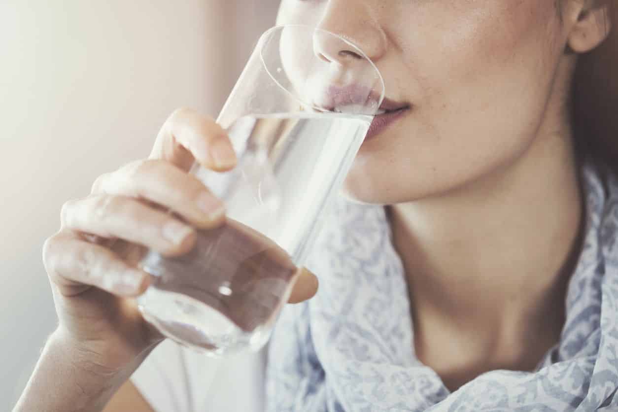 Woman Drinking A Glass Of Water